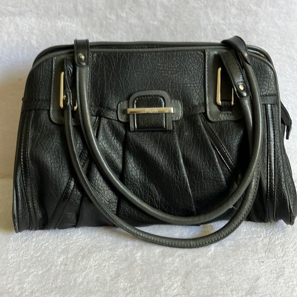 Black Plum bag. Silver tone handle holders .Pre owned